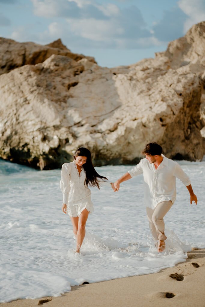 Couple Married in Destination Wedding holding Hands in Romantic Day after shoot by Photographer Nikos Roussis