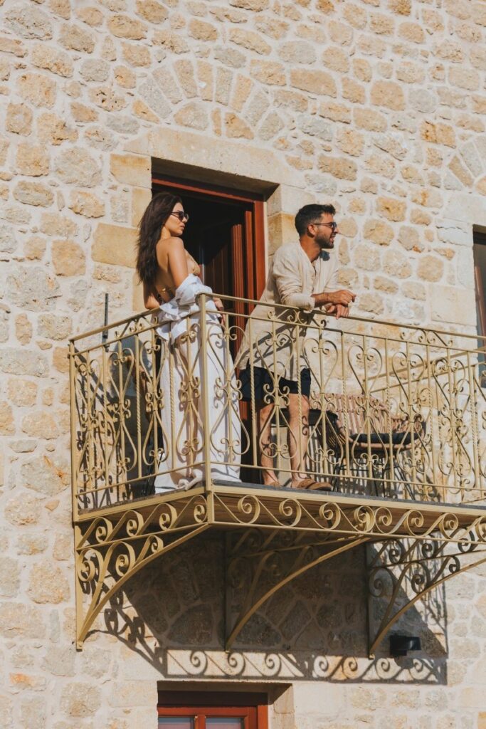 Wedding Couple on Balcony in Brazzo di Maina Wedding Hotel Oitylo Mani