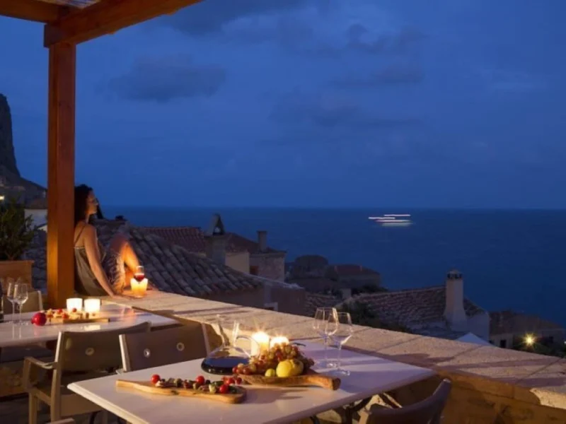 Romantic night sea views from balcony at Moni Emvasis Luxury Suites Monemvasia