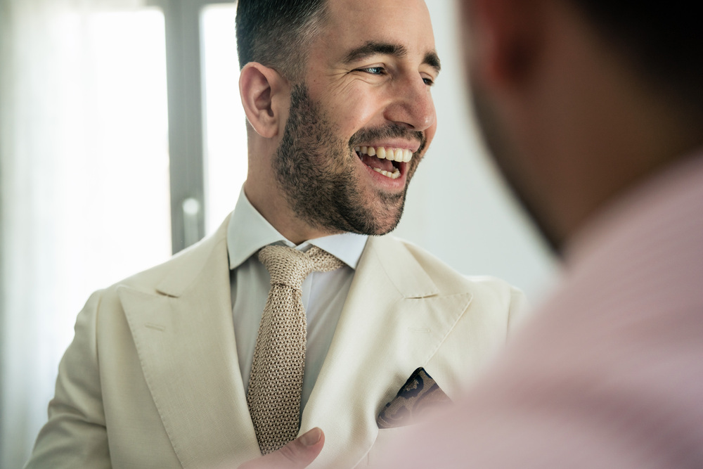 A romantic wedding in Syros - Ilia & Flavio - groom smiling ready for the ceremony