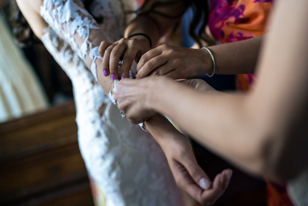 A romantic wedding in Syros - Ilia & Flavio - beautiful wedding dress unbuttoned
