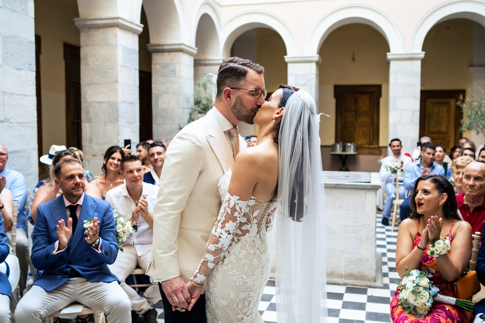 A romantic wedding in Syros - Ilia & Flavio - bride and groom kiss at end of ceremony