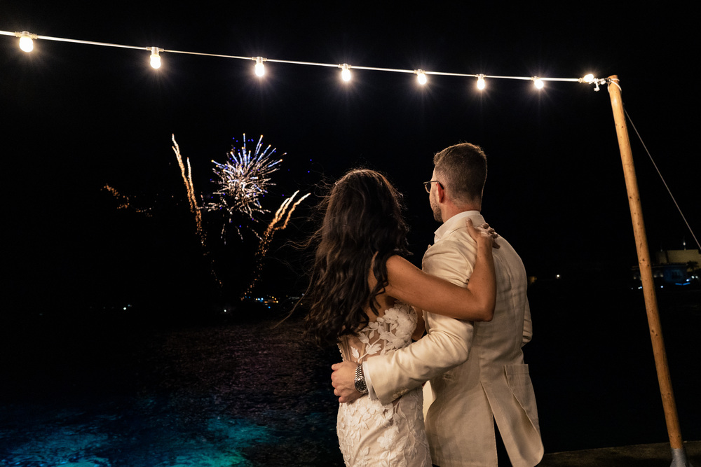 A romantic wedding in Syros - Ilia & Flavio - couple enjoying fireworks
