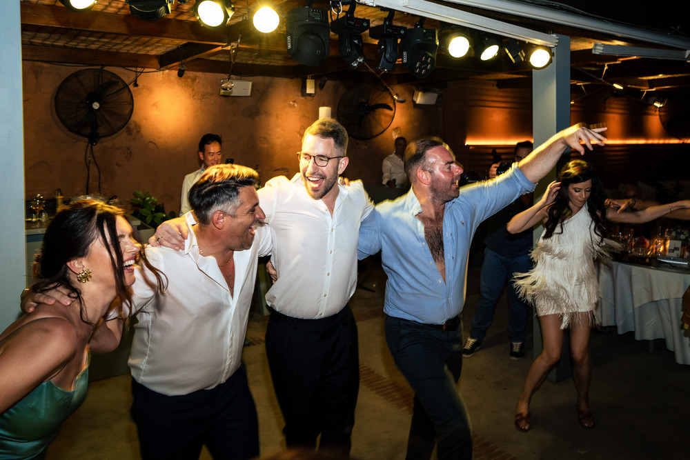 A romantic wedding in Syros - Ilia & Flavio - groom dancing